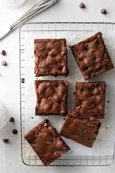 chocolate brownies on a cooling rack with the words best gluten - free brownies