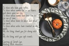 a table setting with silverware, pumpkins and an autumn poem written in cursive writing