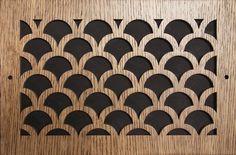 a wooden panel with an intricate design on it