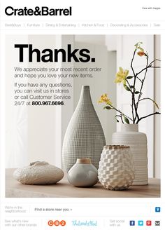 an ad for crate & barrel with vases and flowers