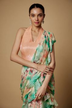 Mint and peach floral print pre-draped saree in flat chiffon base with a ruffled border. Paired with a peach raw silk sequin embroidered padded blouse. - Aza Fashions Elegant Multicolor Blouse For Reception, Silk Sleeveless Blouse For Reception, Sleeveless Silk Blouse For Reception, Elegant Multicolor Sleeveless Blouse, Sleeveless Summer Wedding Pre-draped Saree, Ruffle Sarees, Draped Saree, Padded Blouse, Drape Saree