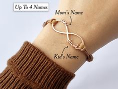 1-6 Names Infinity Bracelet Celebrate the infinite love of family with our personalized infinity bracelet, featuring up to six names chiseled into the design. The first four names are elegantly etched into the legs of the infinity symbol, while the 5th and 6th names are seamlessly integrated into a middle band within the infinity. Perfect for moms and grandmoms, this unique piece symbolizes the unbreakable bond between you and your loved ones, creating a cherished keepsake of enduring love and connection. Materials & Details Premium 925 Silver: 92.5% pure sterling silver, reinforced with 7.5% durable alloys for added strength, longevity, and tarnish resistance. Luxurious Finishes: Also available in 18K gold and 18K rose gold plated versions, expertly layered over sterling silver for a soph Adjustable Anniversary Name Bracelet, Infinity Rose Gold Bracelet For Mother's Day, Rose Gold Infinity Bracelet For Mother's Day, Rose Gold Infinity Bracelets For Friendship, Personalized Infinity Bracelets For Anniversary, Adjustable Names Bracelet Perfect As Gift, Personalized Infinity Bracelets For Mother's Day, Personalized Infinity Bracelet For Mother's Day, Adjustable Name Bracelets For Gifts