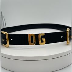 Beautiful Vintage Dolce & Gabbana Genuine Leather Belt In Black And Gold Hardware. Double Buckle With Gold Dg In The Center. Authentic And In Excellent Condition. The Hardware Might Have Some Light Scratches Due To Normal Wear. Dolce Gabbana Belt, Genuine Leather Belt, Gold Hardware, Vintage Accessories, Leather Belt, Genuine Leather, Buckle, Dolce And Gabbana, Women Accessories