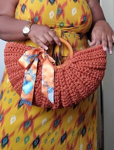 Chic, crochet Handbag, Burnt Orange, Crescent shaped, with Wooden handles. This can be dressed up or down. Very sturdy, very beautiful piece. Lightweight This stylish purse is available in lots of color options! If You need a specific color or colors please message me for questions I would love to work with you. 2. If you need something by a certain date please message me and let me know. I need the date to make sure I have your items to you in plenty of time. Turn-around times can be from one day to several weeks depending on the orders I have. Please message me if you have any questions. 🙂 MEASUREMENTS:  Width - 17.5 inch  Length - 12 inches (from Handle to base) MATERIAL  100% Handmade  100% Macrame cord Wooden Handles SIZE: Medium THINGS TO KNOW *Made to order *Made in a smoke/pet-fre Luxury Crochet Satchel Bag With Braided Handles, Luxury Crochet Bag With Detachable Handle, Yellow Eco-friendly Woven Crochet Bag, Chic Crochet Bag With Woven Leather, Pouch Shape, Multicolor Basket-shaped Crochet Bag With Leather Handles, Handmade Crochet Bags, Stylish Purse, Macrame Cord, Woven Bag