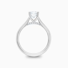 a white gold engagement ring with a princess cut diamond