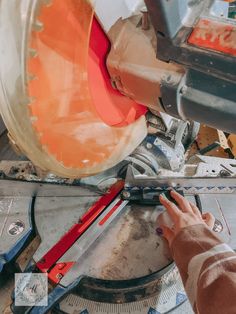 a person using a machine to cut something