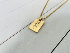 This handmade personalized pendant necklace is for everyday wear. It is also a perfect gift for your loved ones on occasions like Christmas, valentines day, mothers day, fathers day, birthday, anniversary or graduation day!. Pendant: Length: 21.9mm Width: 14.9mm Thickness: 1.9mm Features:- Chain Type: Box Chain  Material: 18K Gold PVD Plated 316L Stainless Steel Color: Gold Personalized Engravable Gift Box (OPTIONAL) This Gold Pendant Necklace can be customized with your own length; it can be en Father's Day Gift Pendant Charm Necklace, Handmade Gold Jewelry For Father's Day, Customized Rectangular Pendant Necklace For Gift, Handmade Dog Tag Jewelry Gift, Father's Day Anniversary Dog Tag Necklace, Handmade Dog Tag Jewelry For Gifts, Custom Name Rectangular Necklaces For Valentine's Day, Gold Necklace For Father's Day Birthday Gift, Customizable Square Pendant Jewelry For Gift