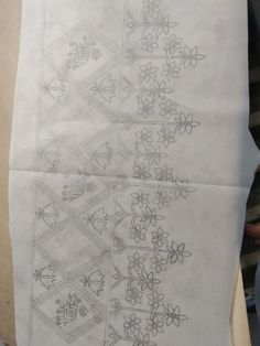 two sheets of paper with designs on them