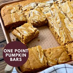 one point pumpkin bars cut into squares in a baking pan