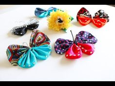 several different types of hair bows sitting on top of a white table next to each other