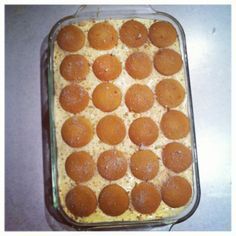 a casserole dish filled with lots of food on top of a countertop