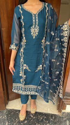 This Indian suit set with a dupatta and beautiful handwork all over in royal blue color is a stunning choice for special occasions and celebrations.  Indian Ethnic, Salwar Kameez, Wedding Wear, Embroidered, Chikankari, Designer, Readymade, Ready to Wear, Anarkali Kurti, Plazzo & Sharara Suit For Women with Embellished Handwork Top Sets , party wear kurts set Bollywood, Jaipur Traditional, Bell Sleeves, Patiala, Party Wear Chikankari Ethnic Wear Designer Dress, Lehenga, Indo Western DressThe defining feature of this suit set is the intricate handwork and embellishments all over the garment.The royal blue color of the ensemble makes a statement on its own, so minimalistic accessories would be ideal to let the outfit shine. The fabric drape beautifully and provide a luxurious feel to the ense Blue Shantoon Lawn Suit With Zari Work, Blue Chinon Lawn Suit For Eid, Shantoon Salwar Kameez With Dabka Work, Blue Semi-stitched Lawn Suit With Self Design, Blue Unstitched Suit With Self Design In Georgette, Semi-stitched Blue Lawn Suit With Self Design, Unstitched Shantoon Suit With Resham Embroidery, Shantoon Dupatta With Self Design For Diwali, Semi-stitched Anarkali Salwar Kameez In Shantoon