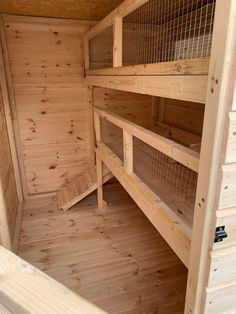 the inside of a wooden cabin with bunk beds