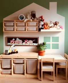 there is a toy kitchen with toys on the counter and shelves in front of it