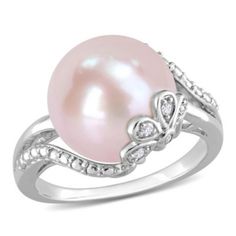 a pink pearl and diamond ring with white diamonds on the sides, set in 18k white gold