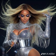 a woman with long hair and silver outfit