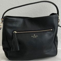 This Chic And Stylish Crossbody Handbag From Kate Spade Will Elevate Any Outfit. The Pebbled Black Leather Gives It A Timeless Look And The Magnetic Closure Keeps Your Belongings Secure. The Adjustable Strap Allows You To Wear It As A Shoulder Or Crossbody Bag, Making It Versatile For Any Occasion. The Interior Lining Is Made Of Black Fabric And The Bag Features The Kate Spade Logo. With Plenty Of Room For Your Essentials, This Bag Is Perfect For Everyday Use Or A Night Out. Don't Miss Out On Th Kate Spade Rectangular Soft Leather Shoulder Bag, Kate Spade Pouch Shoulder Bag With Detachable Strap, Kate Spade Soft Leather Bag For On-the-go, Kate Spade Leather Pouch Shoulder Bag, Kate Spade Soft Leather Shoulder Bag, Kate Spade Rectangular Soft Leather Bag, Kate Spade Soft Leather Bag For Errands, Kate Spade Leather Shoulder Bag For On-the-go, Kate Spade Pouch Shoulder Bag With Adjustable Strap