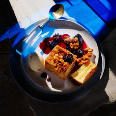 a white plate topped with different types of food on top of a blue table cloth