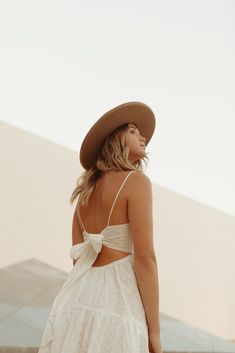 Our Seraphina Dress features an airy cotton fabric perfect for spring + summer. With embroidered eyelet detail throughout, dainty spaghetti straps and a tie back for a customizable fit. Pair it with some gold accessories and strappy sandals or wedges for an easy day or night look! Care + Measurements: 100% cotton Fully lined Hand wash cold S: approx 34.5" L (measured from shoulder to hem of skirt) Spring Sundress With Lace-up Back And Spaghetti Straps, Feminine Sundress With Tie Back And Spaghetti Straps, Feminine Sundress With Spaghetti Straps And Tie Back, Backless Spring Dresses With Bow Straps, Summer Sundress With Adjustable Straps For Garden Party, Adjustable Straps Sundress For Summer Garden Party, Garden Party Sundress With Knotted Spaghetti Straps, White Backless Sundress With Adjustable Straps, Feminine Beach Dress With Lace-up Back