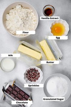 ingredients to make an ice cream sundae laid out on a white counter top, including milk, sugar, and chocolate