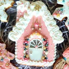 decorated cookies in the shape of houses and animals