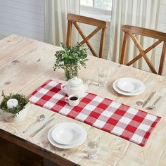 the table is set with plates, cups and utensils