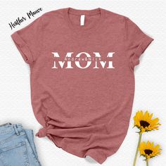 Mothers Day Gift Shirt,Gift For Women,Mom Shirt,Happy Mothers Day,Gift For Mom,Holiday Shirt,Gift For Grandma,First Mothers Day,Mama Shirt 🌟 Welcome to BLG Design Lab! 🌟 We are a small family business dedicated to crafting custom designs on high-quality t-shirts, sweatshirts, long sleeves, tank tops, V-necks, youth and toddler shirts, babysuits, tote bag and towels. Our goal is to provide you with unique, stylish, and comfortable apparel that you'll love. Why Choose Us? 💎 Premium Quality: We Letter Print Tops For Mother's Day, Mother's Day Graphic Tee Tops As Gift, Mother's Day Letter Print Tops Gift, Mother's Day Text Print Top, Mother's Day Gift Tops With Text Print, Mother's Day Gift Tops With Letter Print, Mother's Day Text Print Graphic Tee, Mother's Day Gift Shirt With Text Print, Mother's Day Gift T-shirt With Screen Print