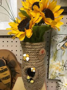 a vase filled with sunflowers sitting on top of a table