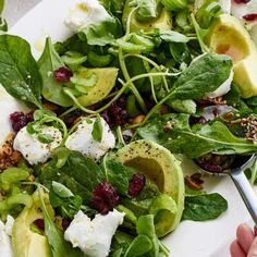 “This impressive classic stars sweet-tart cranberriestangy goat’s cheesecreamy avocadocrunchy seed mix and all of the leavesBest of allit’s ready in 10 minutes.” Dried Raisins, Goat Recipes, Salad Leaves, Spinach Leaves, Watercress, Soft Cheese, Mixed Greens, Cooking Instructions