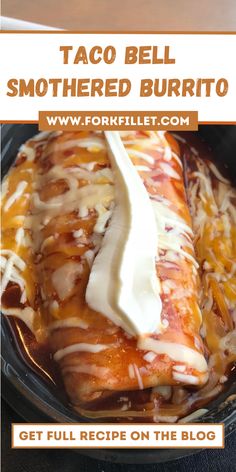 taco bell smothered burrito in a skillet with melted cheese on top