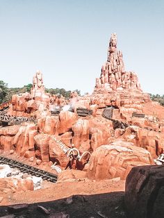 an amusement park with many rocks and trees