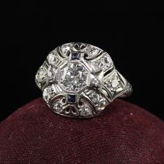 Beautiful Antique Art Deco Platinum Old European Cut Diamond and Sapphire Cocktail Ring. This beautiful ring is crafted in platinum. The ring holds old European cut diamonds that are set in a filigree mounting. The ring is in great condition and sits low on the finger. Item #R1647 Metal: Platinum Weight: 3.7 Grams Size: 6 Diamond: Approximately .60 cts Color: H Clarity: VS2 - SI1 Measurements: Top of the ring measures 14.55 mm wide and band measures 1.73 mm wide. Measurements off the finger: 5.4 Sapphire Cocktail Ring, Watch Cufflinks, Antique Jewelry Rings, Heart Band, European Cut Diamonds, Antique Art Deco, Beautiful Ring, Watch Necklace, Cocktail Ring