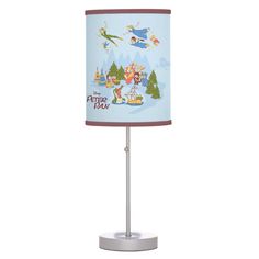 a lamp with cartoon characters on it and a blue shade for the lampshade