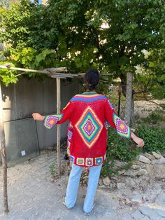 in stock! Granny square red boho style patchwork cardigan vest is combined with inspiration from the rainbow. :) The yarn used in the cardigan is cotton. It will be a unique gift to have a wonderful product for your loved ones for their birthdays and special occasions! Be the sparkle of your festivals and parties! Cardigan Sizes Width 110 cm / 43.3 inches Height 75 cm / 29.5 inches Model Size: 178 cm / 5 Feet 10.79 Inches / 63 kg - 138 lb. washing information It can be washed in the hand wash pr Red Bohemian Outerwear For Festival, Red Bohemian Festival Outerwear, Bohemian Red Long Sleeve Cardigan, Red Bohemian Long Sleeve Cardigan, Red Long Sleeve Cardigan For Festivals, Bohemian Red Crochet Cardigan, Red Bohemian Cardigan With Crochet Details, Red Bohemian Crochet Cardigan, Red Bohemian Crochet Outerwear