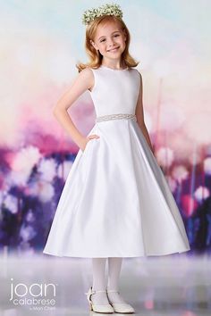 White stunning Communion dress with beaded waistband and neckline and elegant bow back. White Only Call our store for additional availability and sizing options. 631-419-2698 119382 JoanCalabres Designer First Communion Dresses, Mon Cheri Bridal, Bridal Reflections, Modest Bride, Pink Flower Dress, Girls Designer Dresses, Girls Dress Shop, First Communion Dress, First Communion Dresses