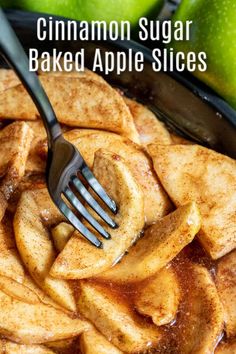 cinnamon sugar baked apple slices in a skillet with a fork sticking out of it