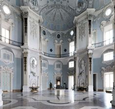 an ornately decorated room with blue walls and ceilings