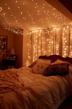 a bedroom with lights strung from the ceiling