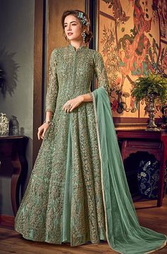 COLOR : Mint Green FABRIC : Top (Jacket) - Net, Bottom (Lehenga) - Santoon, Inner - Crushed Satin, Dupatta - ChiffonWORK : Heavy Zari Work, 3D Tonal Glitter Cord Work, Stones, Sequins, Lace Border OCCASION : Wedding, Reception, Engagement READY-TO-WEAR : NoSTITCHING : Available as semi-stitched fabric, can be stitched using standard size option (+$30). Note: There might be a slight color variation due to lighting and flash used during photoshoot. The bright shade seen is the best closer view of Indian Anarkali Dresses, Lehenga Anarkali, Ethnic Saree, Costume Gris, Indian Anarkali, 3d Material, Anarkali Lehenga, Designer Anarkali Suits, Lehenga Suit