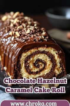 chocolate hazelnut caramel cake roll on a plate with text overlay that reads chocolate hazelmint caramel cake roll