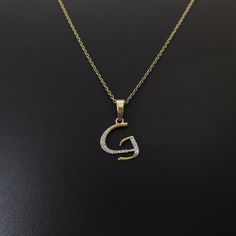 This is an exquisite initial diamond charm pendant set in 14K Solid Gold.  An elegant design, perfect for any occassion ITEM DETAILS: ✓ Letter  : G ✓ Gold Kt: Solid 14K Yellow Gold ✓ 14 K Gold Weight : 0.68 grams ✓ Diamond Shape/ Cut: Round Brilliant ✓ Diamond weight: 0.09 carats  ✓ Diamond No.: 15 Natural Diamonds ✓ Diamond Color: I-J ✓ Diamond Clarity: SI ✓ Gross Weight: 0.70 grams >>The Gold purity is guaranteed and it comes with authentic 14K gold hallmark. >>Jewlery Report provided as well certified by International Gemological Institute (IGI). >>A-Z letters available on my Etsy Shop. CUSTOMER SUPPORT: We are available 24/7 to respond to all your queries! PACKAGING: The pendant comes in layers of safe and secure wrapping along with a free Handmade Jewelry Box. Gold Initial Pendant Name Necklace With Diamond Accents, Gold Initial Pendant Charm Necklace With Diamond Accents, Gold Initial Pendant Charm Necklaces With Diamond Accents, Gold Charm Necklaces With Diamond Accents, Gold Diamond Initial Pendant Charm Necklace, Gold Diamond Necklace With Initials, Gold Diamond Charm Necklace With Initials, Anniversary Diamond Initial Charm Necklaces, Diamond Initials Charm Necklace For Anniversary