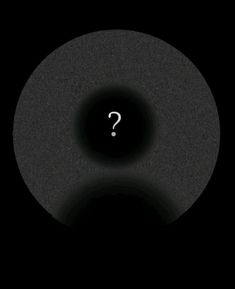 a black circle with a question mark on it in the middle, and a dark background