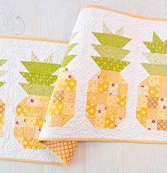 two pineapple quilts sitting on top of each other