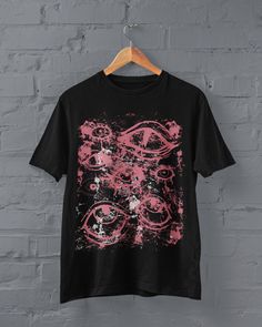 Thanks for stopping by! Grunge Eyes T-shirt Printed on a super soft, cotton tee Dispatched in 5 working days or sooner Unisex Free UK delivery Material: 100% ringspun cotton. Chest (to fit): S  34/36   M  38   L  40/42   XL  44/46   XXL  48/50 ECO-FRIENDLY Each garment is made to order, reducing extra material and energy that would be otherwise wasted We use DTG printing process which is easier on the environment than screen-printing Our ink is bright and also eco-friendly. Do not tumble dry. Wa Emo Crew Neck T-shirt With Graffiti Print, Pink Punk Crew Neck T-shirt, Fairy Grunge Crew Neck T-shirt With Graphic Print, Black T-shirt With Sublimation Print For Alternative Fashion, Halloween Anime Print Grunge T-shirt, Grunge Pink T-shirt For Streetwear, Black Alternative T-shirt With Anime Print, Black Alternative Style T-shirt With Anime Print, Black Alternative Anime Print T-shirt