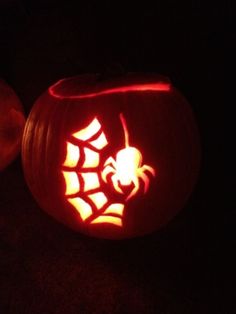 two pumpkins carved to look like they have been carved into the shape of a spider