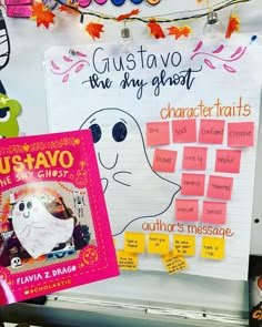 a bulletin board with writing on it and posters attached to the back of it that read gus - tavo, the shy ghost