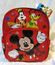 WALT DISNEY MICKEY MOUSE,PLUTO, AND GOOFY 12" BACKPACK WITH TWO MAIN COMPARTMENTS AND SIDE POCKETS! BRAND NEW WITH TAGS!!  Backpack features TWO main compartment with zip closure and adjustable padded shoulder straps. Smaller tack compartment on right side for your calculator,cellular phone,erasers,pencils,pens,etc. Smaller mesh compartment on the left side for your water bottle,powerade,soda can,etc. Backpacks measures approx. on two Large 12" H x 10" W x 4" D Artwork: Popup 3D Applique  » Trad Red Mickey Mouse Backpack, Character Style Standard Backpack For Travel, Character Style Travel Backpack, Red Character Bag For School, Themed Backpack For Everyday Use, Themed Backpack For End Of School Year, Character Style Standard Backpack For End Of School Year, Character Style Backpack For End Of School Year, Mickey Mouse Backpack For Daily Use