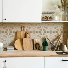 kitchen counter with cutting boards and utensils on it