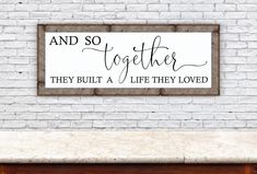 a sign that says and so together they built a life they loved on the wall