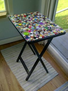 a table with buttons on it in front of a window